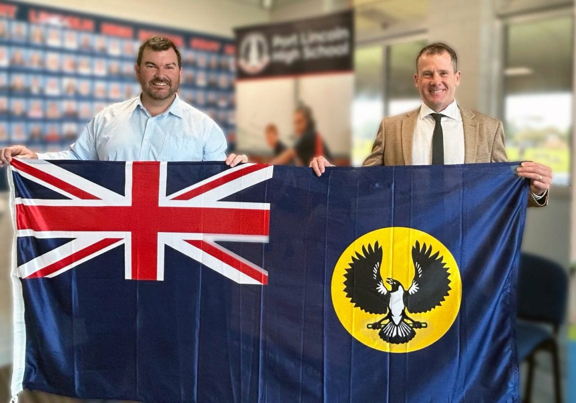 sam-telfer-delivers-new-sa-flag